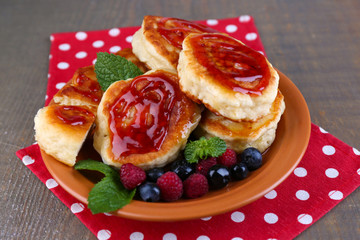 Tasty pancakes with fresh berries, honey and mint leaf