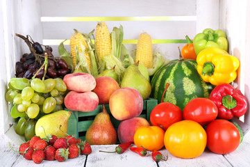 Vegetables on wooden table on white wooden box background