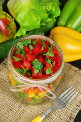 Vegetable salad in glass jars,