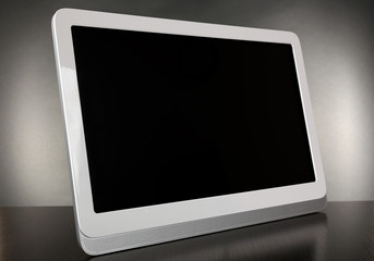 Modern tablet pc on grey background