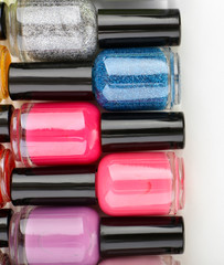 Colorful nail polishes, isolated on white