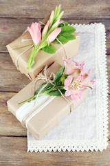Obraz na płótnie Canvas Natural style handcrafted gift boxes with fresh plants and
