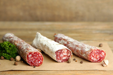 Italian salami on wooden background