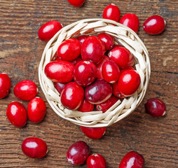 cranberries in a little basket on a table