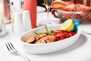 Fried fish with red peppers and lemon.