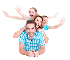 Young happy family with raised hands up