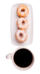 A mug of coffee and homemade doughnut with sugar toppings 