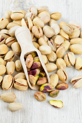 pistachios on wooden surface
