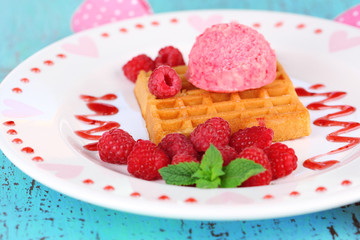 Tasty belgian waffles with ice cream on wooden table