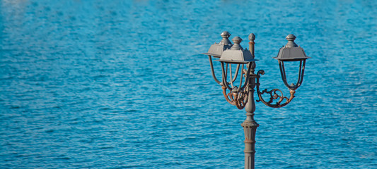 Fototapeta na wymiar lamppost by the sea