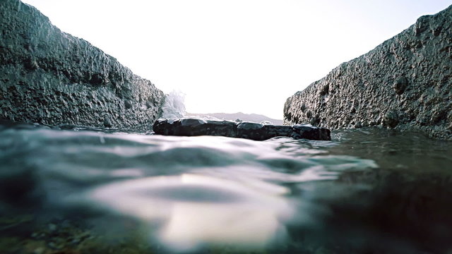 View between two rocks at ocean surface level