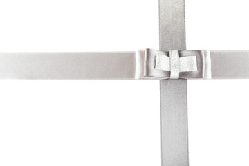 grey and silver ribbon and bow isolated on white