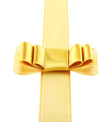 Golden ribbon and bow isolated on white