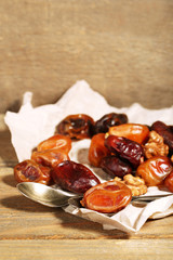 Tasty dates fruits on wooden table