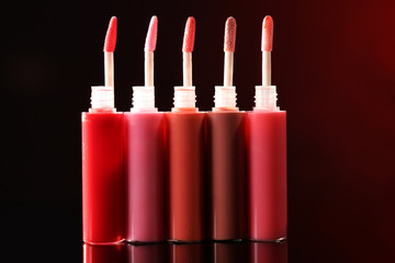Beautiful lip glosses on dark background