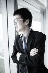 Fototapeta premium Portrait of a businessman looking at the window