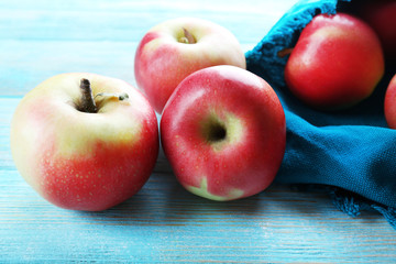 Juicy apples on wooden table, close-up