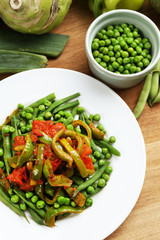 Healthy salad with peas, asparagus and pepper, close-up