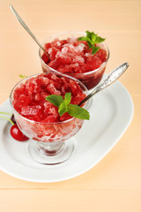 Closeup of cherry granita in glass bowl,