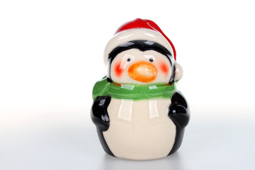 Christmas figurine of penguin with santa hat