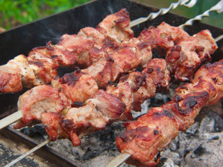 Fresh juicy shashlik on the grill. 