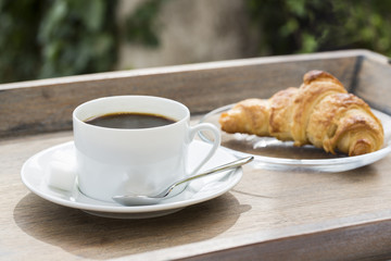 Breakfast with cup of black Coffee and Croissant