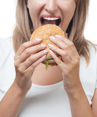 girl eating burger on white background