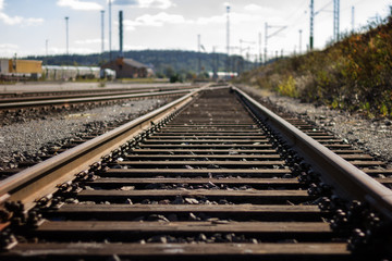 Fototapeta na wymiar Nobody at a straight railroad track outdoors in daylight