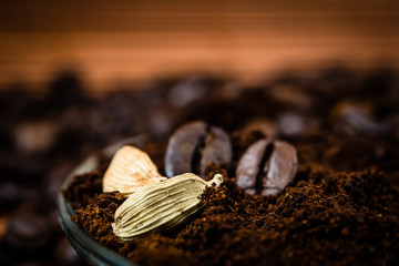 Close up of  cardamon and coffee beans with chocolate.