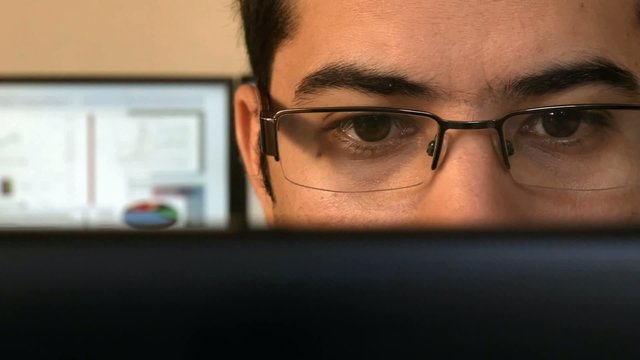 Close up of a young business man at the office.