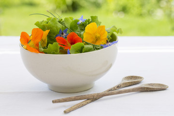 Summer fresh flowors salad in bowl