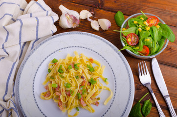 Italian pasta with spring onion and bacon