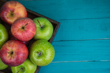 Farm fresh organic red and green apples on wooden table