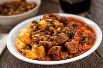 Hot stew with mushrooms and potatoes