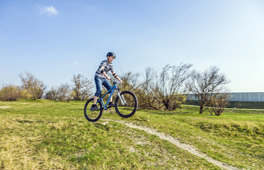 Fototapeta na wymiar teenage boy racing with his dirt bike