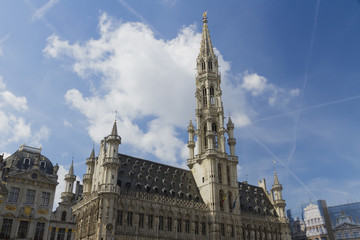 Fototapeta na wymiar Brussels Town Hall, Grand Place, Belgium. Clouds and blue sky.