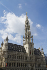 Brussels Town Hall, Grand Place, Belgium. Clouds and blue sky.