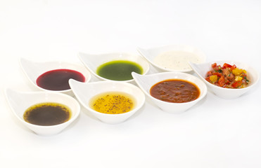 Obraz na płótnie Canvas sauces on a white background in the restaurant