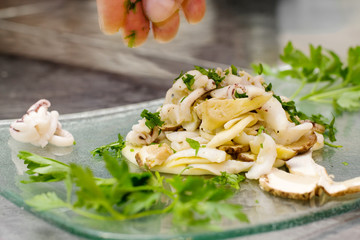 recipe palte with small octopus, boletus and mashed potato