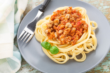 Spaghetti bolognese with basil leave