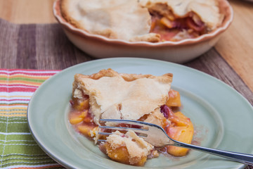 Slice of fresh peach pie