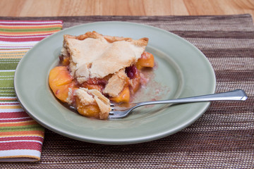 Slice of fresh peach pie