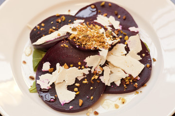 roasted beet salad with chopped pistachios and ricotta cheese