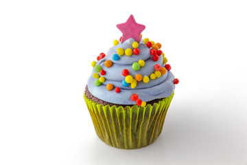 cupcake with blueberry frosting and colorful sprinkles