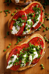 Bruschetta with fresh tomato,  cheese  and chive