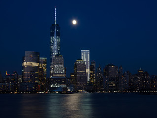 Downtown New York City skyline at night with moon