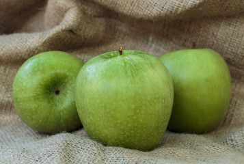 Granny Smith green apple's on the burlap background