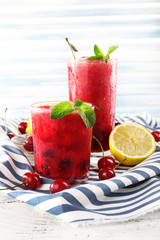 Fresh cold cherry cocktail with mint and lemon