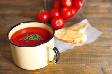 Homemade tomato juice in color mug, toasts and fresh tomatoes