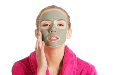 Relaxed woman with a nourishing face mask